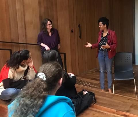 Resa Gooding leading a small-group workshop, answering questions from attendees